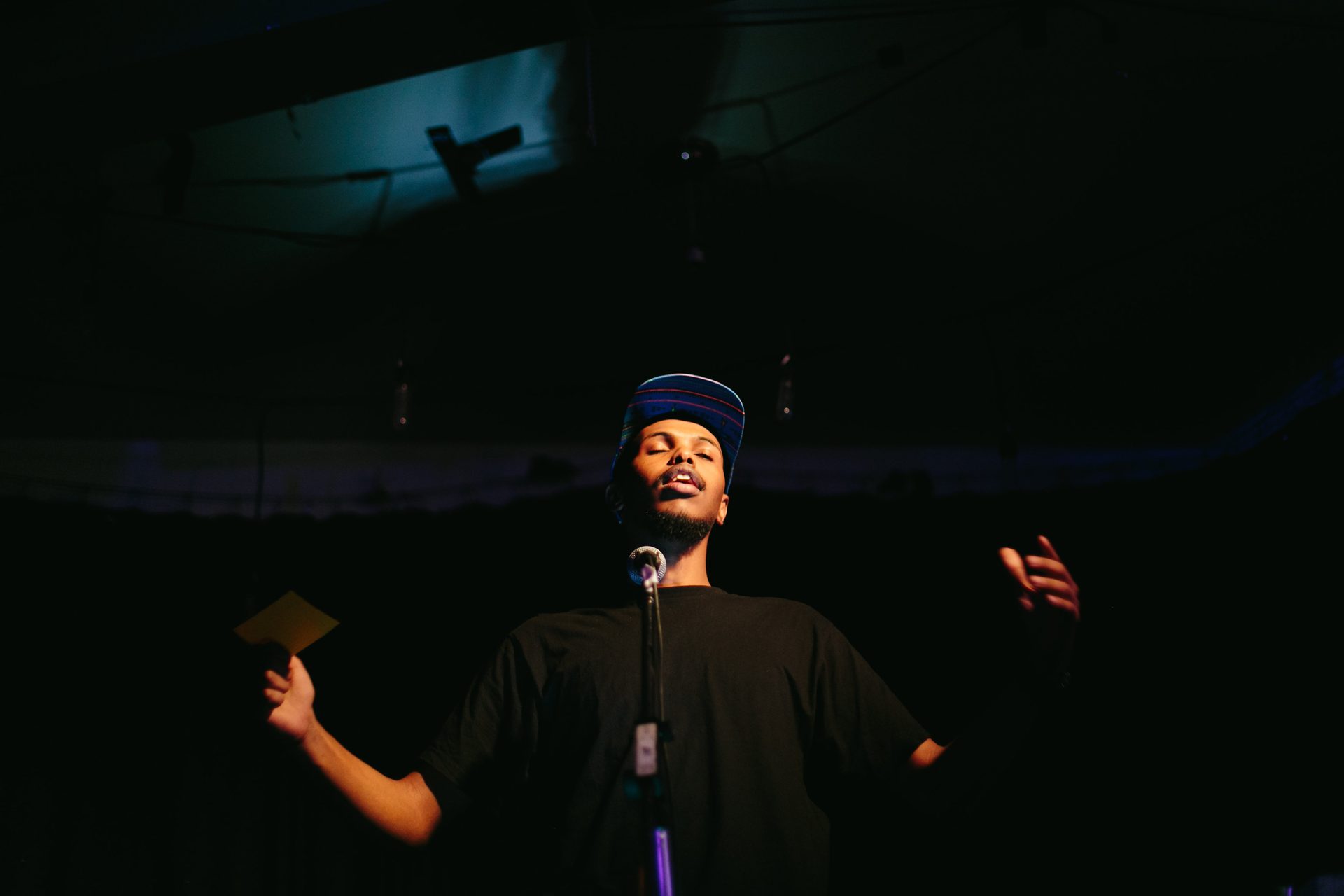 Ahmed Knowmadic Ali performing on stage